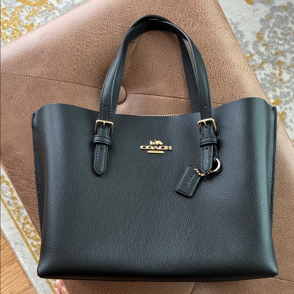 Coach Black Leather Tote with Gold Accents and timeliness completely new!